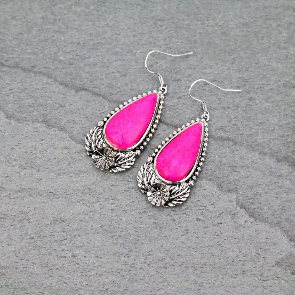 Pink teardrop stone earrings with silver setting border