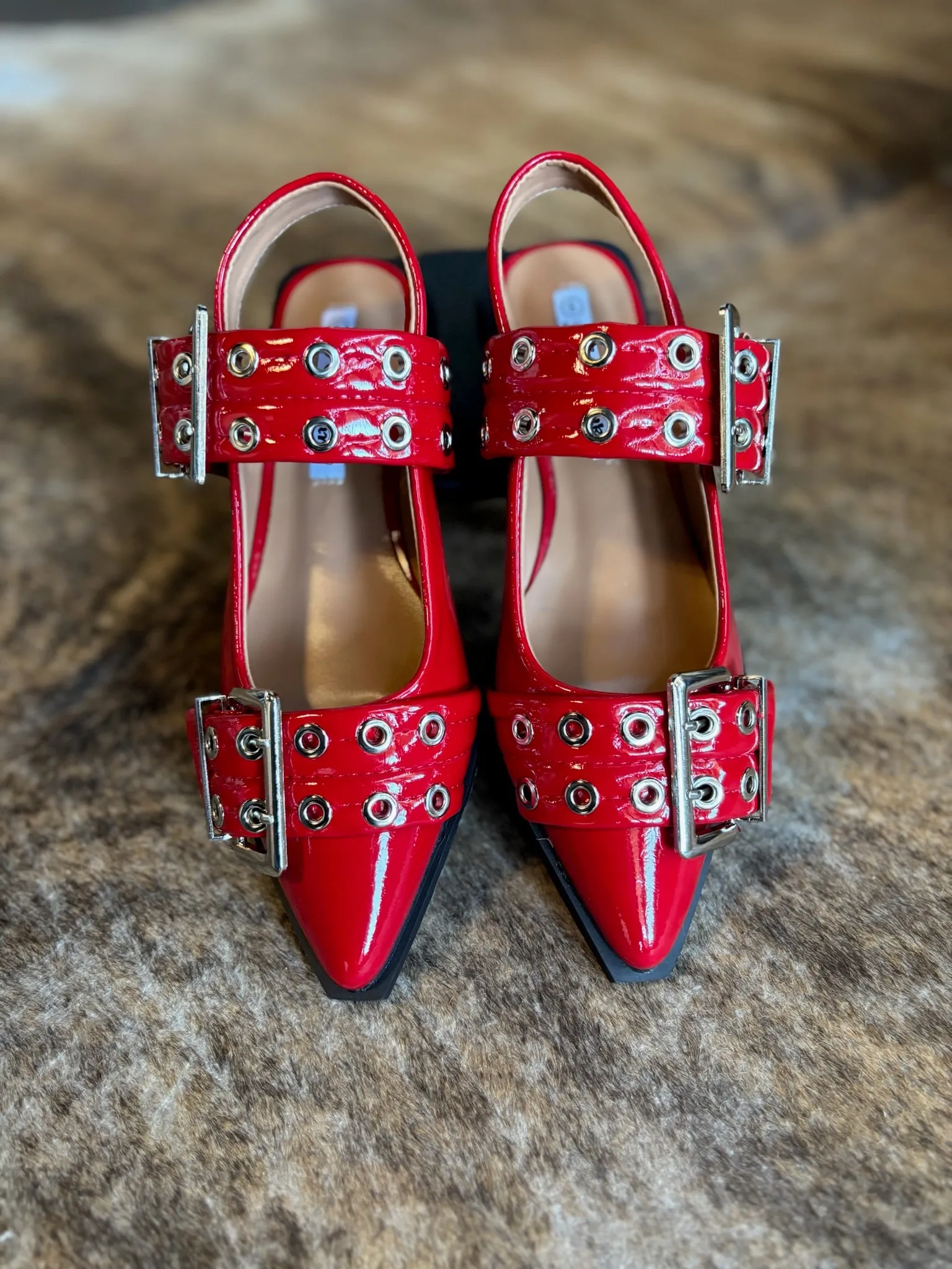 Red buckle mules